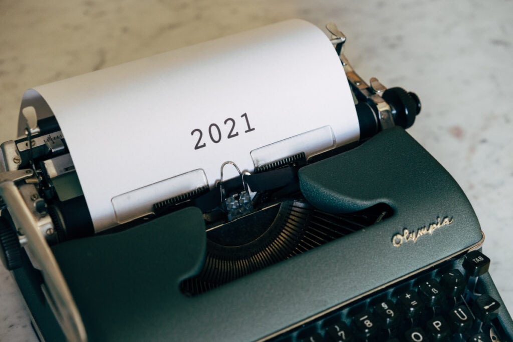 a typewriter with a piece of paper in it with 2021 on the paper