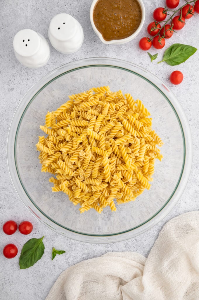 a glass bowl filled with gluten free pasta