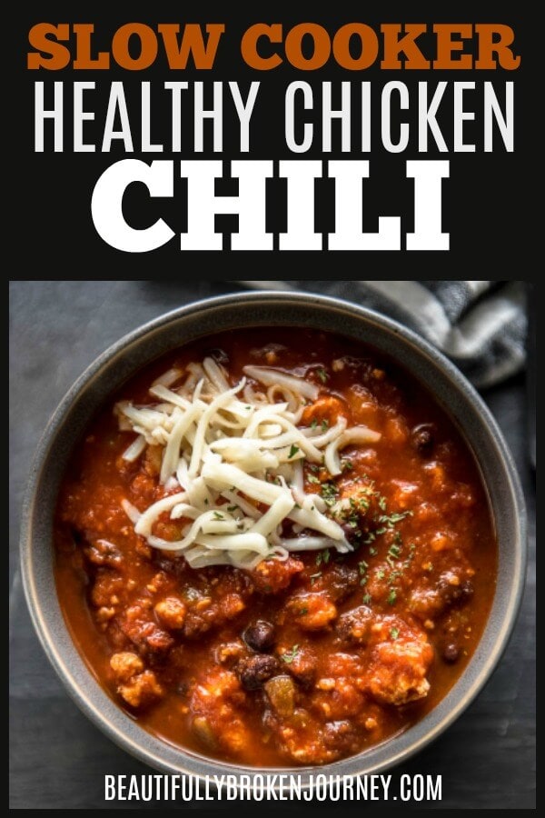This Slow Cooker Healthy Chicken Chili is an easy recipe that is big on flavor and the perfect bowl of comfort food when it's cold outside! #chili #slowcooker #chickenchili #groundchicken #fallrecipes #easyrecipes