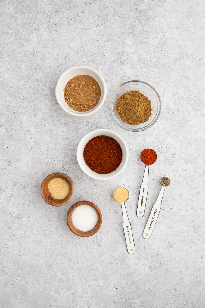 an overhead picture of the spices needed to make gluten free chili seasoning