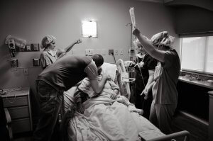 Husband and wife and nurses prior to going into operating room