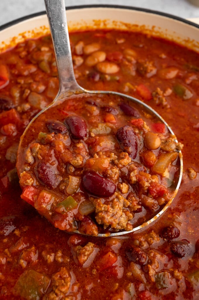 a spoon full of dutch oven chili up close