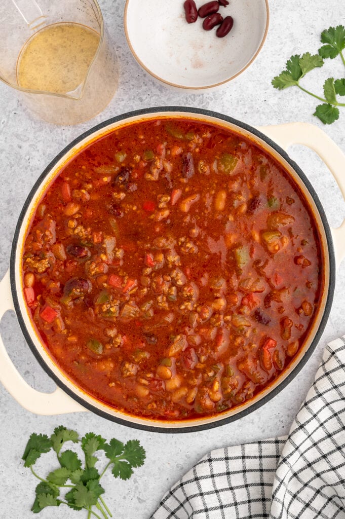 a dutch oven filled with chili