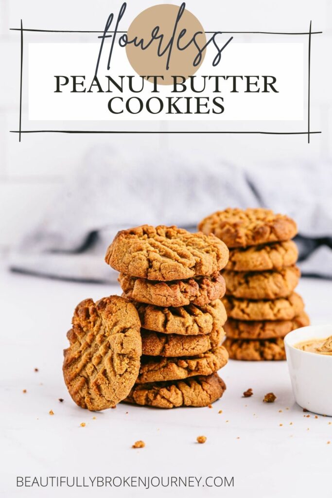 pile of peanut butter cookies on a white background