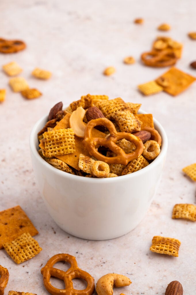 a white small bowl filled with gluten free chex mix