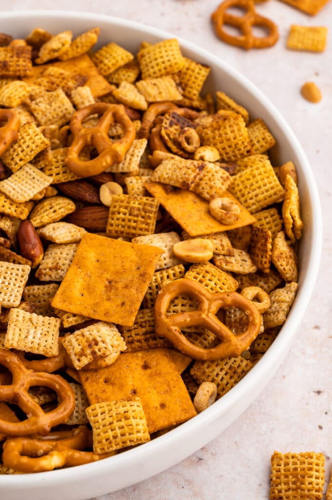 up close picture of gluten-free chex mix in a white bowl