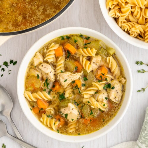 gluten free chicken noodle soup in a white bowl