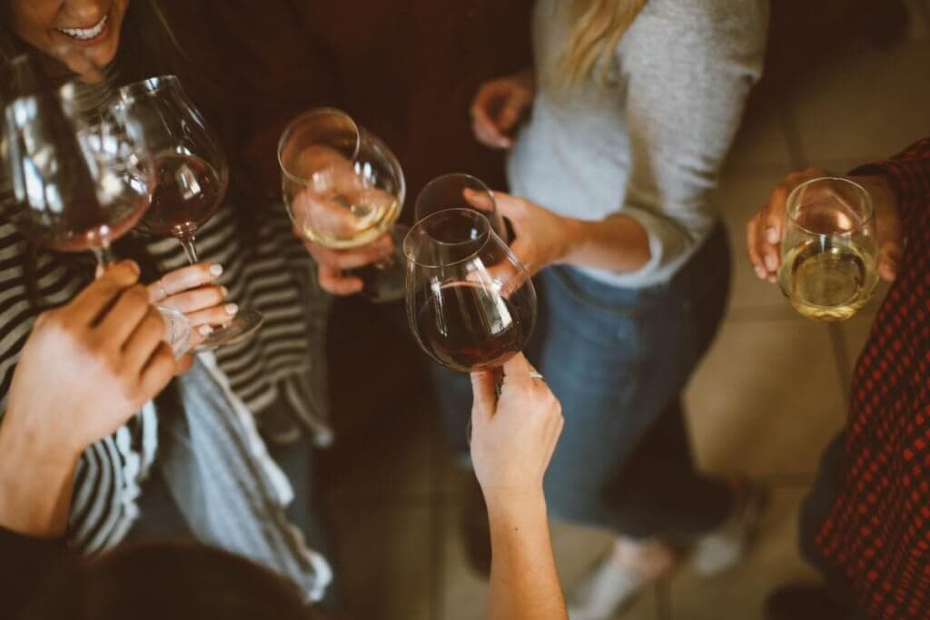 Women holding glasses of wine