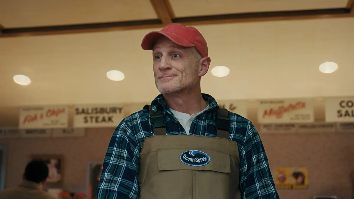 Ocean Spray Cranberries' new brand character, Johnny, appears in a still for the brand's latest creative under its new masterbrand "Just Add Cran."