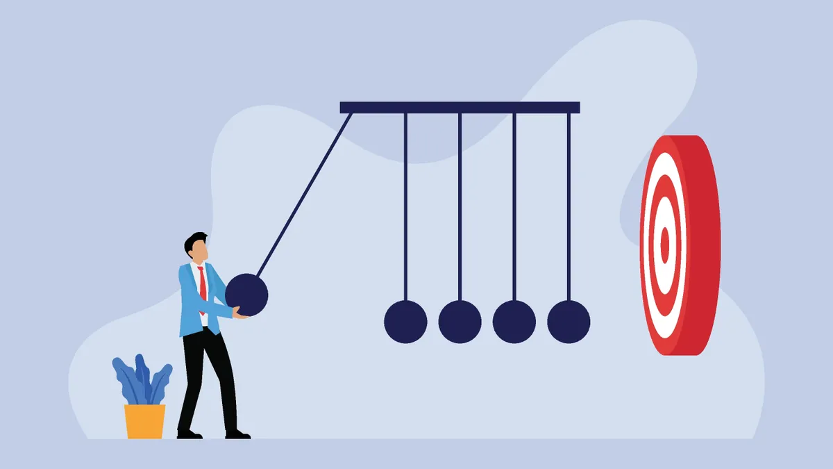 Businessperson with balancing balls newtons cradle and business target