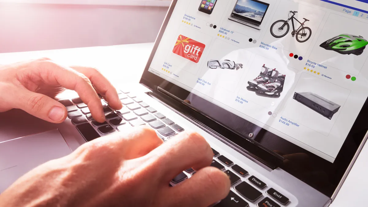 A person looking at product listings on a computer.