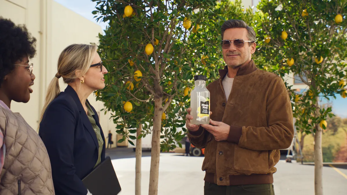 Actor Jon Hamm holds up a bottle of Minute Maid Zero Sugar as part of an ad campagin